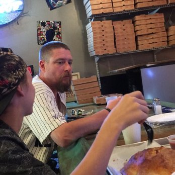 Sliced - Sitting at the bar - Pizza Near Me - Hoschton, Georgia Sliced - Sitting at the bar - Pizza Near Me - Hoschton, Georgia