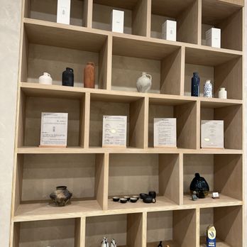Teazzi Tea Shop - Shelf with merch at the top (?), decorations, and details about the types of tea and toppings they serve - Bubble Tea Near Me - Monterey Park, California
