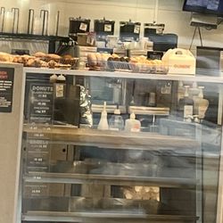 Dunkin' - Donuts out of case and covered in flies half an hour before store is supposed to close.