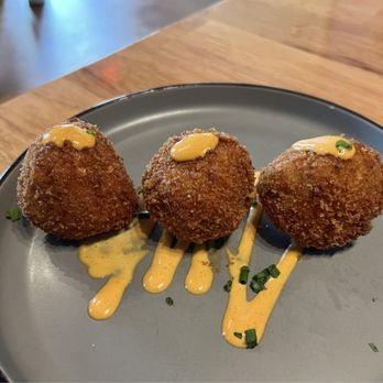Revel Market and Bar - Braised Pork Arancini - Bars Near Me - Richmond, Virginia Revel Market and Bar - Braised Pork Arancini - Bars Near Me - Richmond, Virginia