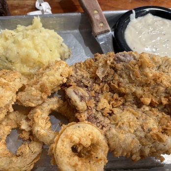 Smitty's Cafe & Bakery - Half order chicken fried steak, mashed potatoes and onion rings. Gravy on the side. - Cafes Near Me - Brenham, Texas Smitty's Cafe & Bakery - Half order chicken fried steak, mashed potatoes and onion rings. Gravy on the side. - Cafes Near Me - Brenham, Texas