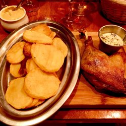 Duck confit with sorrel sauce and sautéed potatoes