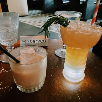 Conspiracy - Left: Bartenders Choice--coconut based w spices and rum  Right: Rockefeller Center - Cocktail Bars Near Me - Middletown, Connecticut