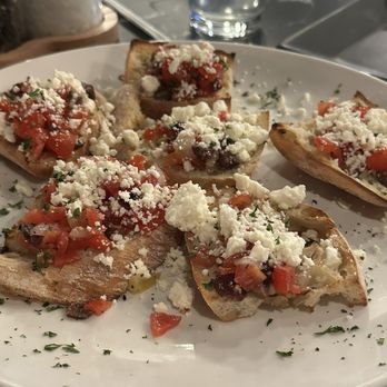 Napoli's Italian - Bruschetta- Toasted Italian Ciabatta Bread, Cherry Tomatoes, Red Onions, Kalamata Olives, Feta Cheese. - Italian Near Me - Midvale, Utah Napoli's Italian - Bruschetta- Toasted Italian Ciabatta Bread, Cherry Tomatoes, Red Onions, Kalamata Olives, Feta Cheese. - Italian Near Me - Midvale, Utah