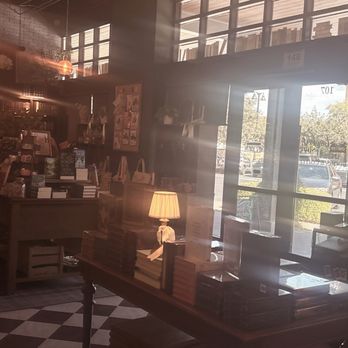 The Bookish Shop - the entryway filled with tables and shelves that have books and knickknacks. - Bookstores Near Me - Gilbert, Arizona
