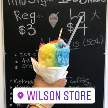 Wilson Store - Regular size Rainbow "Ice Shave" with a bite taken out. Regular $3, Large $4 and 50¢ add ons (ice cream, azuki, and snow cap). - Shaved Ice Near Me - Kailua, Hawaii Wilson Store - Regular size Rainbow "Ice Shave" with a bite taken out. Regular $3, Large $4 and 50¢ add ons (ice cream, azuki, and snow cap). - Shaved Ice Near Me - Kailua, Hawaii