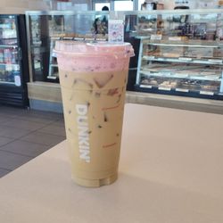 Tasty pink foam on iced latte