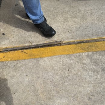 Firehouse Subs - Parking lot hazard with employee's foot - Sandwiches Near Me - Alexandria, Louisiana Firehouse Subs - Parking lot hazard with employee's foot - Sandwiches Near Me - Alexandria, Louisiana