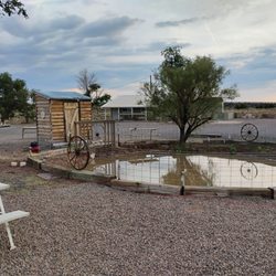Root 66 Sun Valley RV Park - Solar lights and picnic tables surround beautiful pond make a very relaxing getaway from Interstate 40.