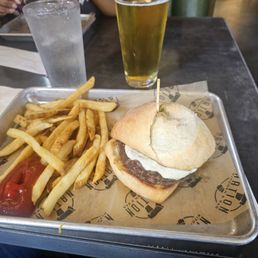 Caprese burger and fries. Lager beer. Caprese burger and fries. Lager beer.