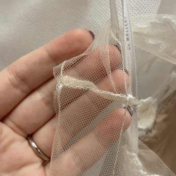 David's Bridal - Sleeve they didn't even use the same color as the dress material - Bridal Near Me - Clearwater, Florida