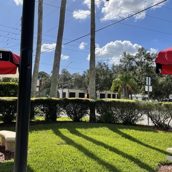 Side Door Deli - a row of picnic tables and umbrellas - Delis Near Me - Saint Petersburg, Florida