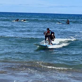 Goofy Foot Surf School - Kelani piggy backed my 5 year old when he freaked out seeing a man-o-war on the board - Surfing Near Me Goofy Foot Surf School - Kelani piggy backed my 5 year old when he freaked out seeing a man-o-war on the board - Surfing Near Me