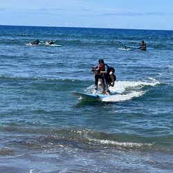 Goofy Foot Surf School - Kelani piggy backed my 5 year old when he freaked out seeing a man-o-war on the board