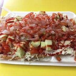 Paleteria y Neveria Las Michoacanas - Duroloco ( duro sheet topped with cabbage, pico, cucumber, cueritos, sour cream, cheese, and hot sauce)