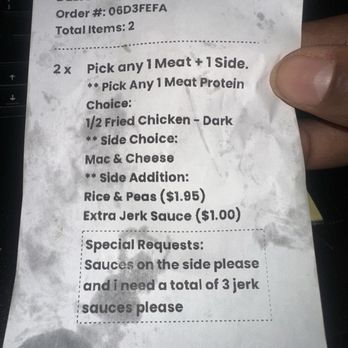 Jerky Jerk - They put fried chicken on the receipt Cleary not what i ordered! Jerky jerk dark GRILLED - A crumpled receipt from Jerky Jerk in Rolling Meadows, IL, showing an order for two meals with specific meat and side choices, including extra sauces. - Caribbean Near Me - Rolling Meadows, Illinois