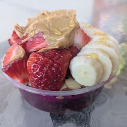 Mamma’s Juicery - Acai + pitaya bowl with strawberries, banana, peanut butter, honey, granola, almonds, and raisins