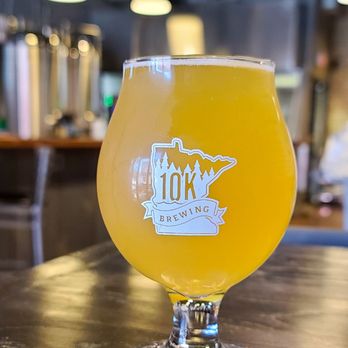10K Brewing - a glass of beer on a table - Breweries Near Me - Anoka, Minnesota 10K Brewing - a glass of beer on a table - Breweries Near Me - Anoka, Minnesota