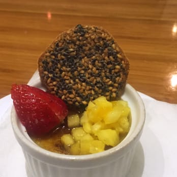 Tojo's - creme brûlée, light syrup, fresh strawberry and finely chopped mango; crispy, toasted sesame cookie - Japanese Near Me - Vancouver, British Columbia Tojo's - creme brûlée, light syrup, fresh strawberry and finely chopped mango; crispy, toasted sesame cookie - Japanese Near Me - Vancouver, British Columbia
