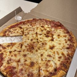 Nancy's Pizza - Don't mind my son grabbing a slice before I took the photo haha .