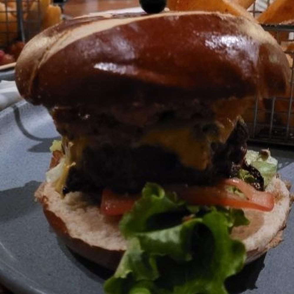 Grain - Stout Burger (the burger was about a third of the size of the bun) - Beer Gardens Near Me - Norfolk, Virginia Grain - Stout Burger (the burger was about a third of the size of the bun) - Beer Gardens Near Me - Norfolk, Virginia