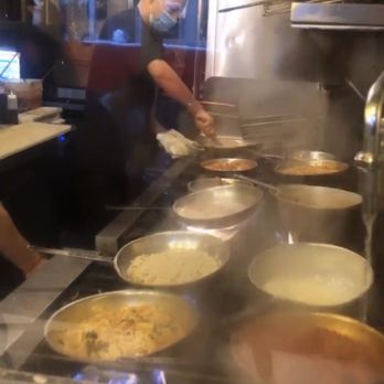 Carmelina's - Bar seat view of the cooking process. There is a glass in between. - Italian Near Me - Boston, Massachusetts