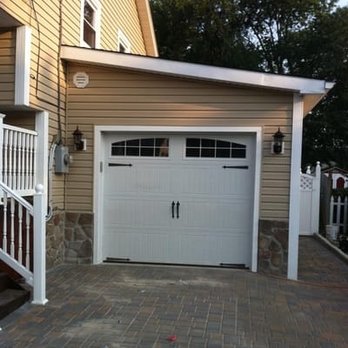 NFL Landscaping Group - a home with a white garage door - Landscaping Near Me - Richfield, Ohio NFL Landscaping Group - a home with a white garage door - Landscaping Near Me - Richfield, Ohio