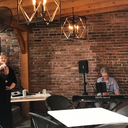 Carly Johnson, vocalist, and her fellow keyboard artist, playing jazz and bossanova on the patio Sunday morning, 6/26/2022