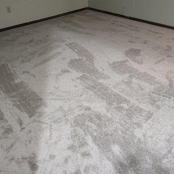 Precision Flooring - an empty room with a carpeted floor - Flooring Near Me