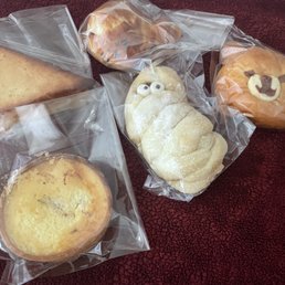 Sweet bread slice (forgot the name), blueberry baked cheese tart, neko pan, pumpkin spice mummy (seasonal), and kuma choco custard Sweet bread slice (forgot the name), blueberry baked cheese tart, neko pan, pumpkin spice mummy (seasonal), and kuma choco custard