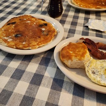 Wimberley Cafe - Blueberry Pancake,biscuit , one egg, two pieces bacon Cranberry juice & ice water plus 2 jellies. - American Near Me - Wimberley, Texas Wimberley Cafe - Blueberry Pancake,biscuit , one egg, two pieces bacon Cranberry juice & ice water plus 2 jellies. - American Near Me - Wimberley, Texas