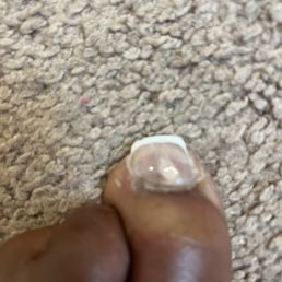 Look at the product around my toenail that I had to come home and file off! Look at the product around my toenail that I had to come home and file off!