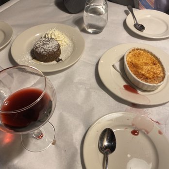 Gatsby's Landing - (Left) molten chocolate cake (right) Creme Brulee and remanence of the wine I dropped - New American Near Me - Roslyn, New York