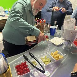My husband working behind bar at my daughters engagement party