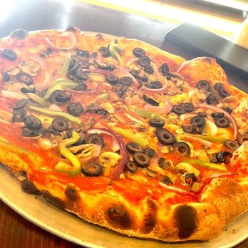 PizzaVola - a pizza with olives and peppers - Pizza Near Me - Cocoa Beach, Florida PizzaVola - a pizza with olives and peppers - Pizza Near Me - Cocoa Beach, Florida