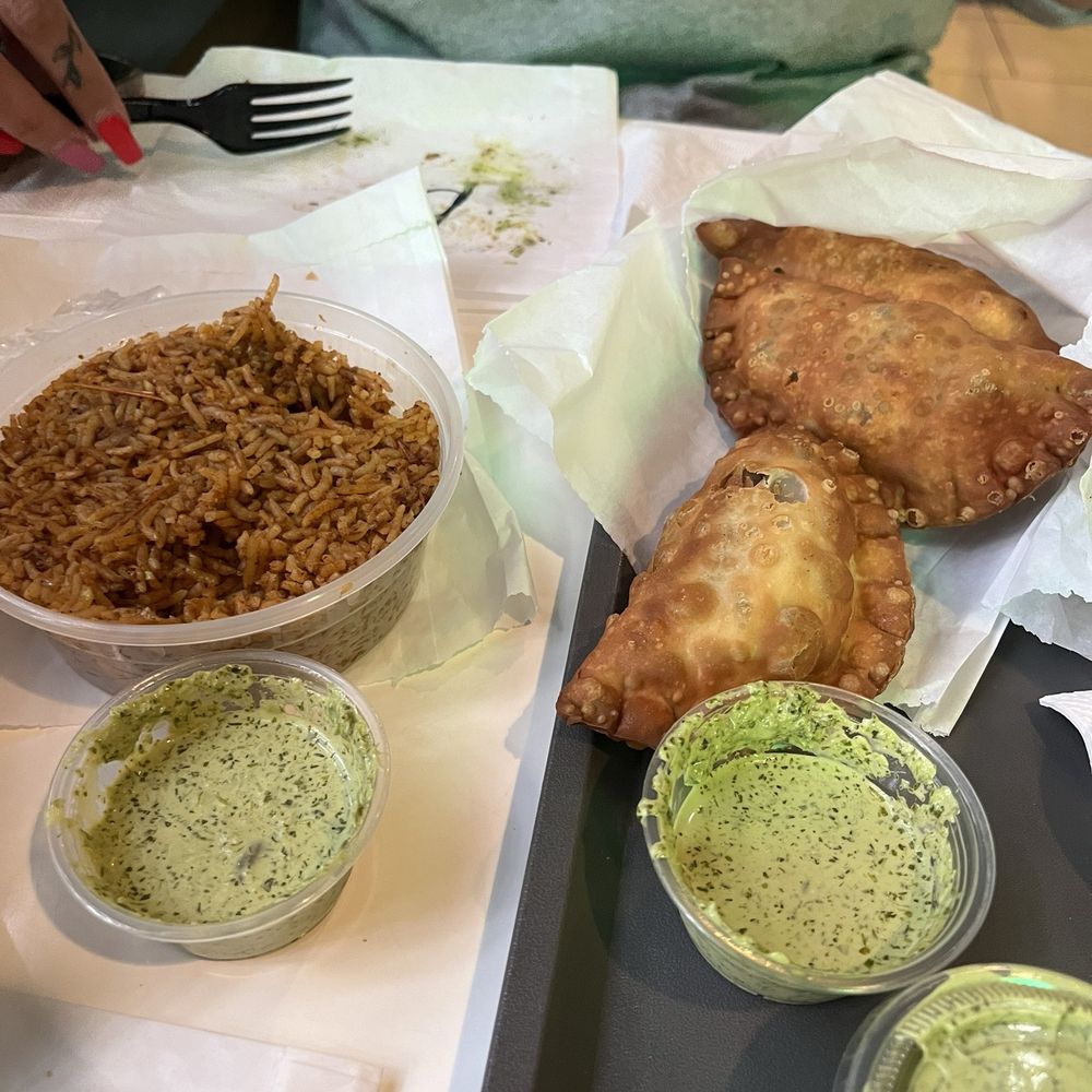 Traphouse Caribbean - Jollof Rice (Side) 8oz  OxTail Phatty Trapsauce 1oz - Caribbean Near Me - Austin, Texas