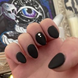 Matte black nails with some crystals