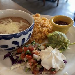 Beans, rice, guac, sour cream, pico and a special sauce. Yum!