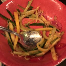 Half eaten mango salad. (Mango cucumber, pickles onion,peanuts, jalapeño)