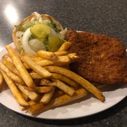 Pork tenderloin sander with fries.