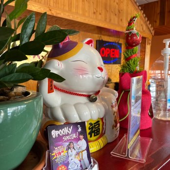 Fuji Cafe - a cat statue and a bottle of water - Sushi Bars Near Me - Collierville, Tennessee