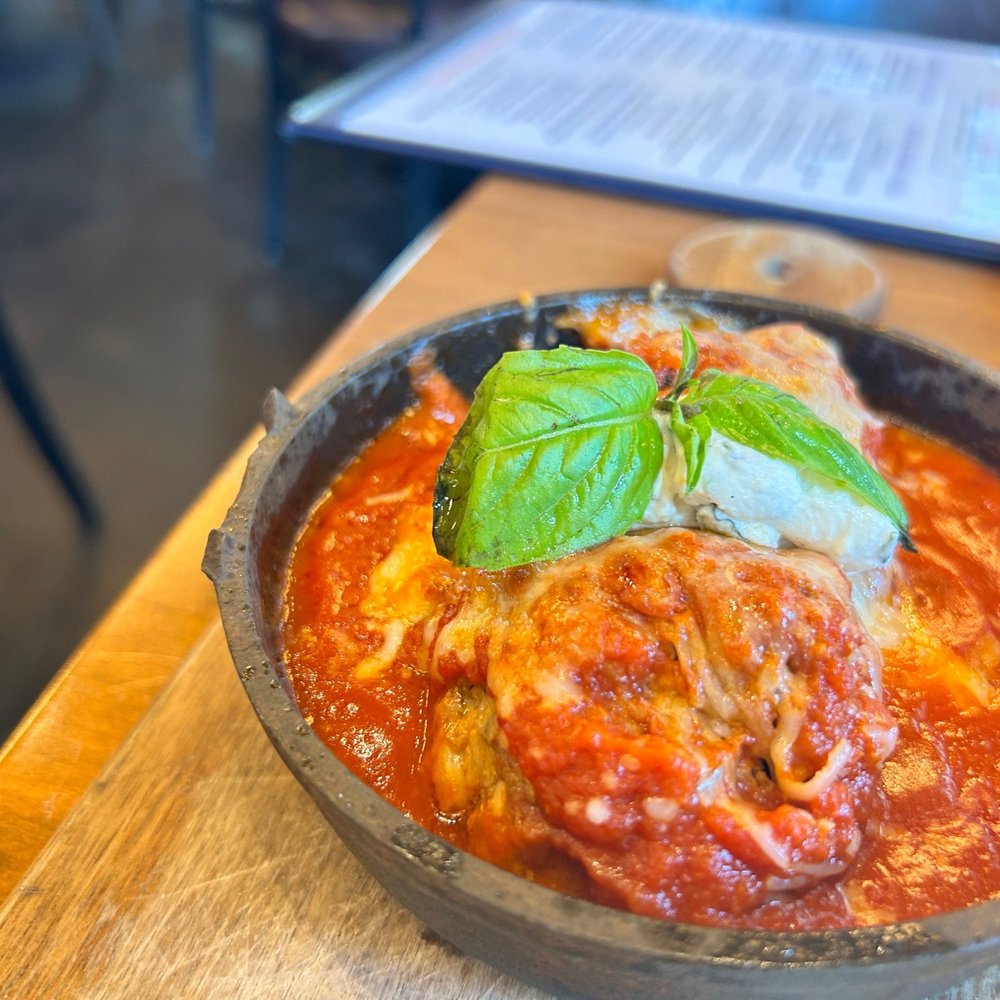 Cru - a bowl of pasta with meat and basil - Wine Bars Near Me - Atlanta, Georgia