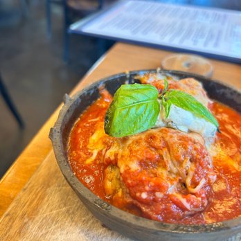 Cru - a bowl of pasta with meat and basil - Wine Bars Near Me - Atlanta, Georgia