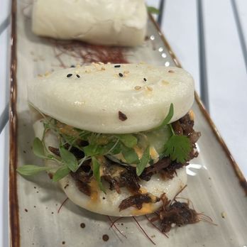 Pink Dolphin - Pork belly bao - Peruvian Near Me - Miami, Florida Pink Dolphin - Pork belly bao - Peruvian Near Me - Miami, Florida