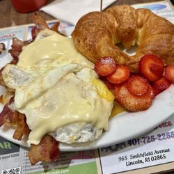 Maria's Breakfast & Lunch - Bacon, egg, and cheese on a croissant