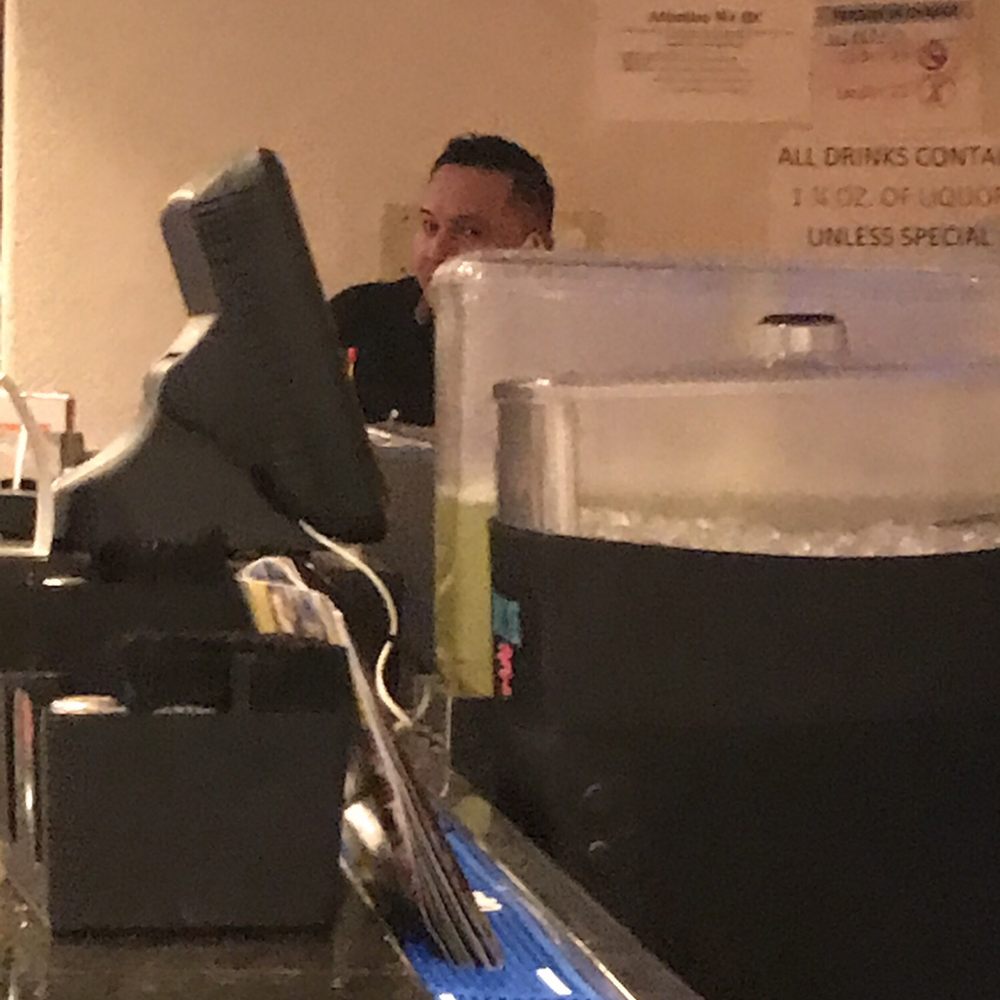 Our Bartender/Server on the cell phone for 26 minutes while waiting for our order to be taken. Cinco Dos, Adios.... Never Again