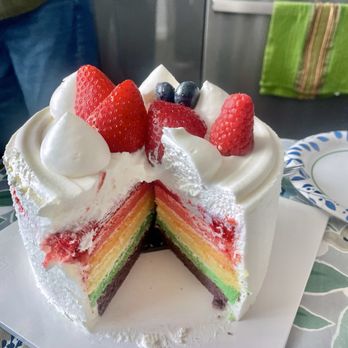 Paris Baguette - Rainbow cake with plastic sleeve removed--great reveal of beautiful (and tasty) layers. - Cafes Near Me - Chula Vista, California