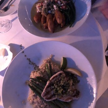 Louie's Backyard - Grilled Corinder And Pepper Rubbed Swordfish Grouper Special in saffron butter sauce - New American Near Me - Key West, Florida