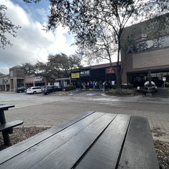 Interstellar BBQ - The line here was long. I'm actually sitting at the picnic table by the pits. - Barbeque Near Me - Austin, Texas