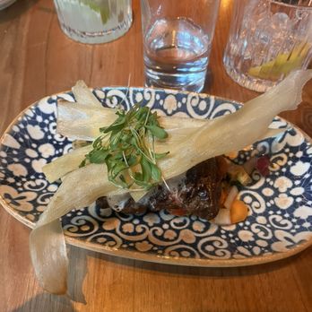 Mariel - On top is slivers of plantain fried to a nice crispiness and served over steak - Cuban Near Me - Boston, Massachusetts Mariel - On top is slivers of plantain fried to a nice crispiness and served over steak - Cuban Near Me - Boston, Massachusetts